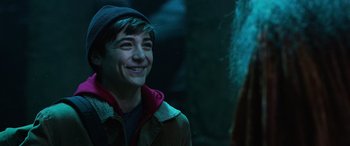 Movie still from “Shazam!” (2019), directed by David F. Sandberg – A young man smiling while standing next to a woman; Close Up shot, Over the shoulder angle