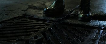 Movie still from “Shazam!” (2019), directed by David F. Sandberg – A shoe on the ground in the dark; Extreme Close Up shot, Overhead angle