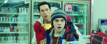 Movie still from “Shazam!” (2019), directed by David F. Sandberg – A man and a boy are in a grocery store; Close Up shot, Over the shoulder angle