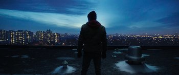 Movie still from “Shazam!” (2019), directed by David F. Sandberg – A man standing on top of a building looking out at a city; Wide shot, Low angle