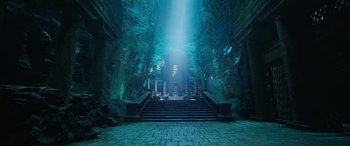 Movie still from “Shazam!” (2019), directed by David F. Sandberg – The entrance to a cave with steps leading to the entrance; Extreme Wide shot, Low angle