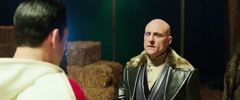 Movie still from “Shazam!” (2019), directed by David F. Sandberg – A wax figure of a bald man wearing a leather jacket; Close Up shot, Over the shoulder angle