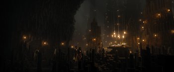 Movie still from “Shazam! Fury of the Gods” (2023), directed by David F. Sandberg – A group of people standing in a dark room; Extreme Wide shot, High angle