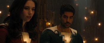 Movie still from “Shazam! Fury of the Gods” (2023), directed by David F. Sandberg – A man and a woman are standing in a room; Close Up shot, Over the shoulder angle