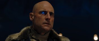 Movie still from “Shazam! Fury of the Gods” (2023), directed by David F. Sandberg – A bald man with a scar on his face; Close Up shot, Low angle