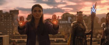 Movie still from “Shazam! Fury of the Gods” (2023), directed by David F. Sandberg – A woman holding out her hand in front of another woman; Medium shot, Over the shoulder angle