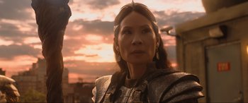 Movie still from “Shazam! Fury of the Gods” (2023), directed by David F. Sandberg – A person wearing a costume; Close Up shot, Over the shoulder angle