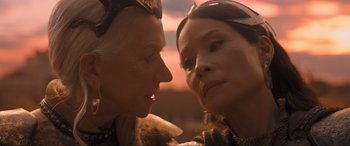Movie still from “Shazam! Fury of the Gods” (2023), directed by David F. Sandberg – Two people are looking at each other in the sunset; Close Up shot, Over the shoulder angle