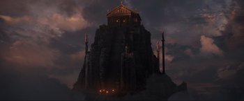 Movie still from “Shazam! Fury of the Gods” (2023), directed by David F. Sandberg – An image of an image of a temple in the middle of the night; Extreme Wide shot, Low angle