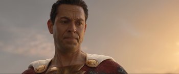 Movie still from “Shazam! Fury of the Gods” (2023), directed by David F. Sandberg – A person wearing a costume; Close Up shot, Over the shoulder angle