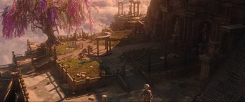 Movie still from “Shazam! Fury of the Gods” (2023), directed by David F. Sandberg – An image of an outside scene with a person standing on the ground; Extreme Wide shot, High angle