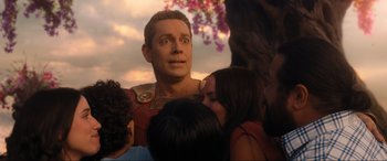 Movie still from “Shazam! Fury of the Gods” (2023), directed by David F. Sandberg – A person with a bunch of other people; Close Up shot, Over the shoulder angle