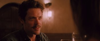 Movie still from “Shelter in Place” (2021), directed by Connor Martin – A person with a mustache; Close Up shot, Over the shoulder angle
