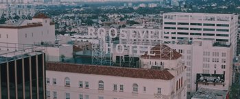 Movie still from “Shelter in Place” (2021), directed by Connor Martin – A view of the roosevelt hotel from the top of a building; Extreme Wide shot, Low angle