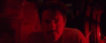 Movie still from “Shelter in Place” (2021), directed by Connor Martin – A person with a mustache; Close Up shot, Low angle