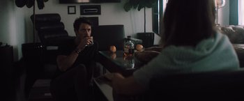 Movie still from “Shelter in Place” (2021), directed by Connor Martin – A group of people sitting at a table drinking wine; Medium shot, Over the shoulder angle
