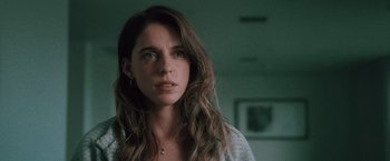 Movie still from “Shelter in Place” (2021), directed by Connor Martin – A person with long brown hair; Close Up shot, Low angle