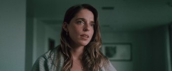 Movie still from “Shelter in Place” (2021), directed by Connor Martin – A person with long brown hair; Close Up shot, Low angle