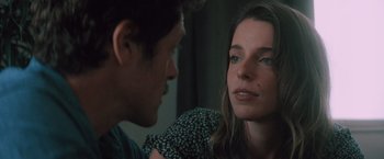 Movie still from “Shelter in Place” (2021), directed by Connor Martin – A man and a woman looking at one another; Close Up shot, Over the shoulder angle