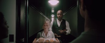 Movie still from “Shelter in Place” (2021), directed by Connor Martin – A man and a woman sitting on a train; Medium shot, Low angle