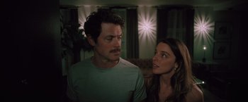 Movie still from “Shelter in Place” (2021), directed by Connor Martin – A man and a woman looking at one another; Close Up shot, Over the shoulder angle