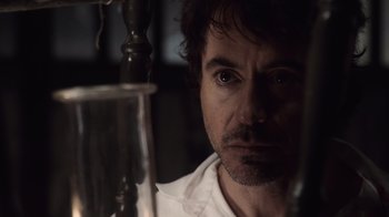 Movie still from “Sherlock Holmes” (2009), directed by Guy Ritchie – A person looking at the camera; Close Up shot, Over the shoulder angle