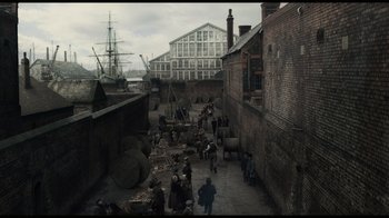 Movie still from “Sherlock Holmes” (2009), directed by Guy Ritchie – An image of an old time scene in a city setting; Extreme Wide shot, High angle