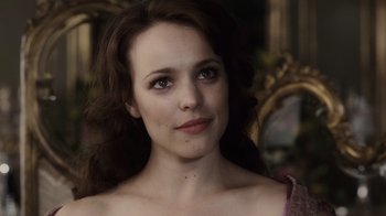 Movie still from “Sherlock Holmes” (2009), directed by Guy Ritchie – A person with long brown hair; Close Up shot, Over the shoulder angle
