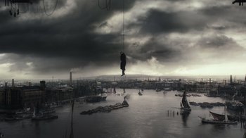 Movie still from “Sherlock Holmes” (2009), directed by Guy Ritchie – An image of a man hanging from a rope in the middle of the ocean; Extreme Wide shot, Low angle