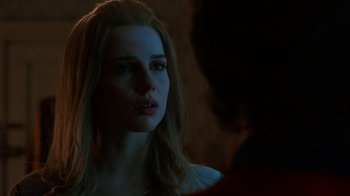 Movie still from “Bohemian Rhapsody” (2018), directed by Bryan Singer – A woman is looking at a man in a dark room; Close Up shot, Over the shoulder angle