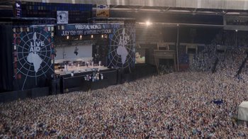 Movie still from “Bohemian Rhapsody” (2018), directed by Bryan Singer – A large crowd of people in a large stadium; Extreme Wide shot, High angle
