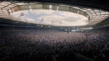 Movie still from “Bohemian Rhapsody” (2018), directed by Bryan Singer – A large crowd of people in a stadium; Extreme Wide shot, High angle