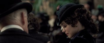 Movie still from “Sherlock Holmes: A Game of Shadows” (2011), directed by Guy Ritchie – A person wearing a hat; Close Up shot, Over the shoulder angle