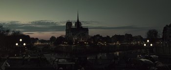 Movie still from “Sherlock Holmes: A Game of Shadows” (2011), directed by Guy Ritchie – A large cathedral in the background of a dark night sky; Extreme Wide shot, High angle
