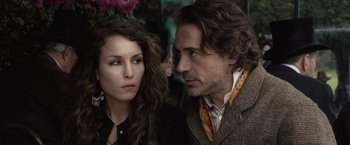 Movie still from “Sherlock Holmes: A Game of Shadows” (2011), directed by Guy Ritchie – A man and a woman standing next to each other; Close Up shot, Over the shoulder angle