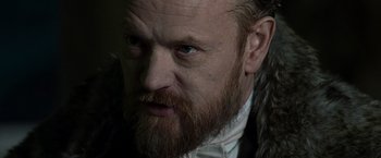 Movie still from “Sherlock Holmes: A Game of Shadows” (2011), directed by Guy Ritchie – A person with a beard; Close Up shot, Over the shoulder angle