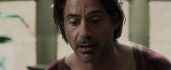 Movie still from “Sherlock Holmes: A Game of Shadows” (2011), directed by Guy Ritchie – A person with a beard; Close Up shot, Over the shoulder angle