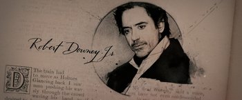 Movie still from “Sherlock Holmes: A Game of Shadows” (2011), directed by Guy Ritchie – A black and white photo of downey jr; Extreme Close Up shot, High angle