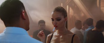 A beautiful woman with a cigarette in her mouth