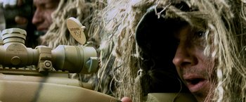 Movie still from “Shooter” (2007), directed by Antoine Fuqua – A person is holding a video camera in their hand; Extreme Close Up shot, Low angle
