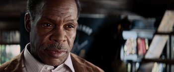 Movie still from “Shooter” (2007), directed by Antoine Fuqua – An older man is looking at the camera; Close Up shot, Low angle