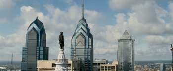 Movie still from “Shooter” (2007), directed by Antoine Fuqua – A statue of a man on top of a tall building; Extreme Wide shot, Low angle