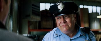 Movie still from “Shooter” (2007), directed by Antoine Fuqua – A man in a police officer's uniform and hat; Close Up shot, Low angle