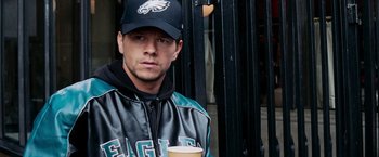 Movie still from “Shooter” (2007), directed by Antoine Fuqua – A person wearing a baseball cap; Close Up shot, Over the shoulder angle