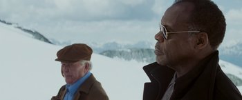 Movie still from “Shooter” (2007), directed by Antoine Fuqua – Two older men standing next to each other in the snow; Close Up shot, Low angle