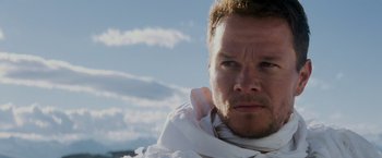 Movie still from “Shooter” (2007), directed by Antoine Fuqua – A person wearing a white shirt; Close Up shot, Low angle