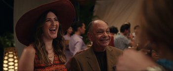 Movie still from “Shotgun Wedding” (2022), directed by Jason Moore – A man and a woman are smiling for the camera; Medium shot, Over the shoulder angle