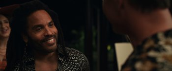 Movie still from “Shotgun Wedding” (2022), directed by Jason Moore – A person with a dreadlock; Close Up shot, Over the shoulder angle