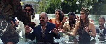 Movie still from “Shotgun Wedding” (2022), directed by Jason Moore – A group of people standing in a body of water; Medium shot, High angle