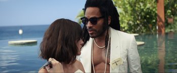 Movie still from “Shotgun Wedding” (2022), directed by Jason Moore – A man and a woman wearing sunglasses and a white suit; Close Up shot, Over the shoulder angle